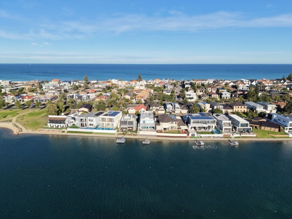 A stunning aerial view of a suburban neighborhood in Adelaide, Australia, by the ocean.